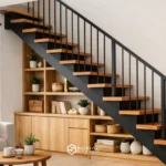 Tangga kecil minimalis di rumah type 36 dengan desain lurus dan railing besi hitam.